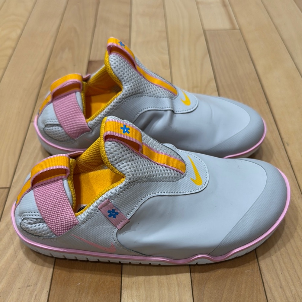 BRAND NEW 
Nike Gray and Pink Slip-On Sneakers